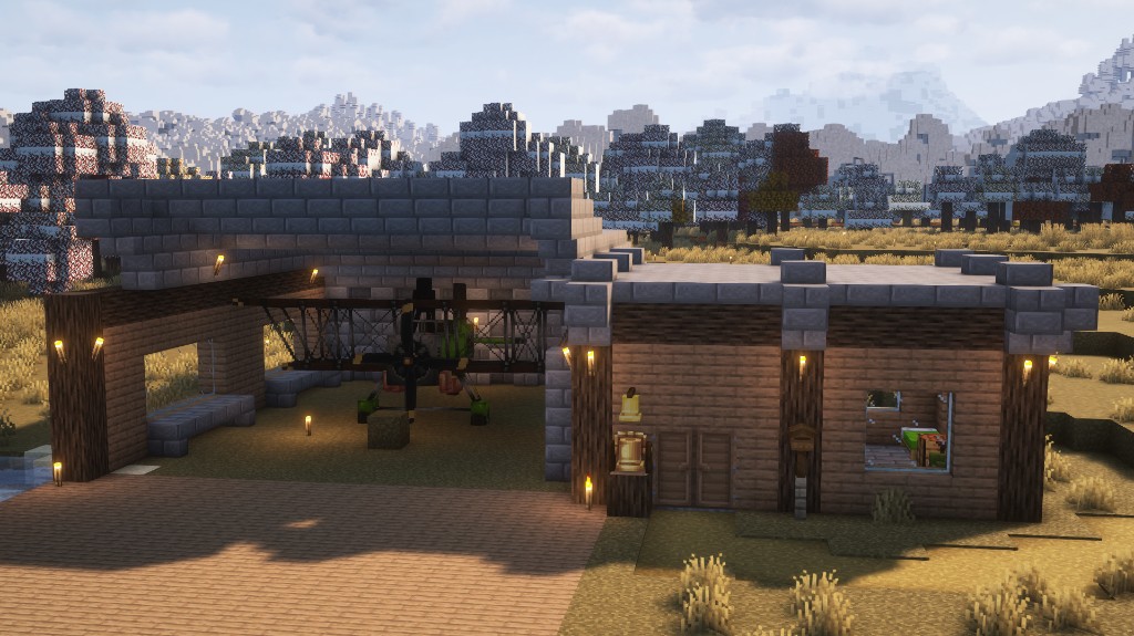 Minecraft hangar with a biplane and a small wooden cabin in front of snowy forest and mountains.