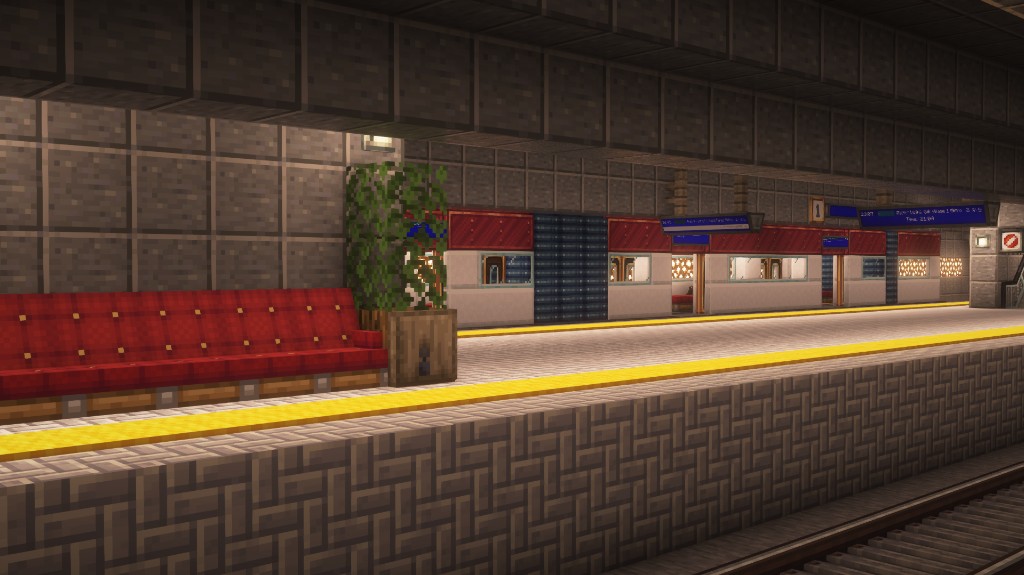 Clean underground metro platform with a modern train and station lighting.